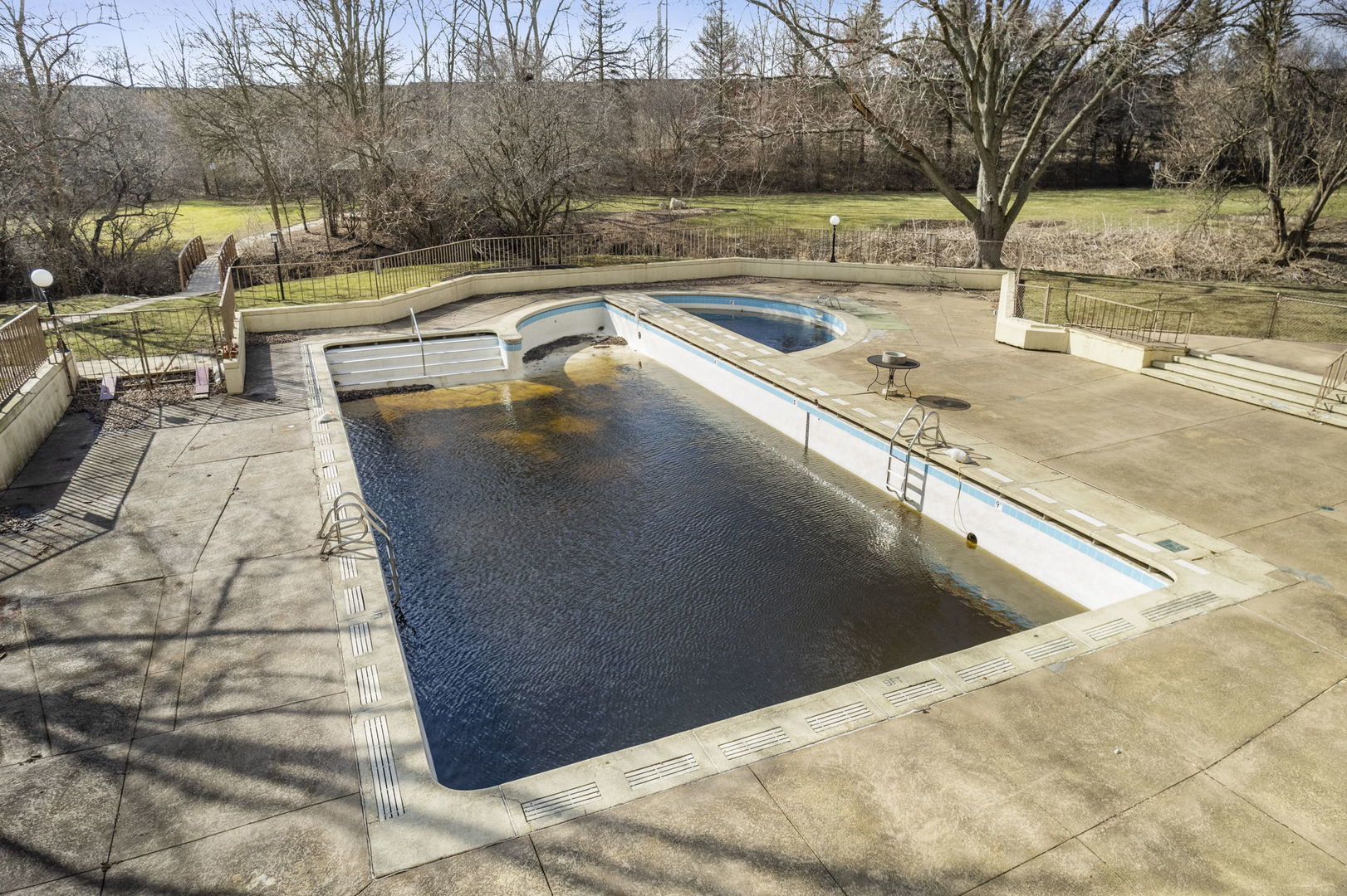 425 Walnut Creek Road, Unit 1401 Lisle, IL 60532 - Photo 14 of 19 a view of a swimming pool with a patio