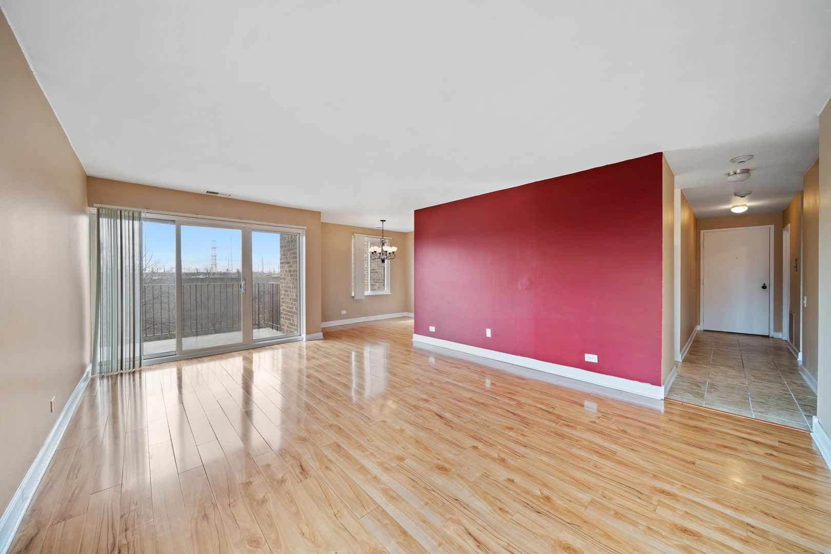 425 Walnut Creek Road, Unit 1401 Lisle, IL 60532 - Photo 3 of 19 a view of an empty room with glass door