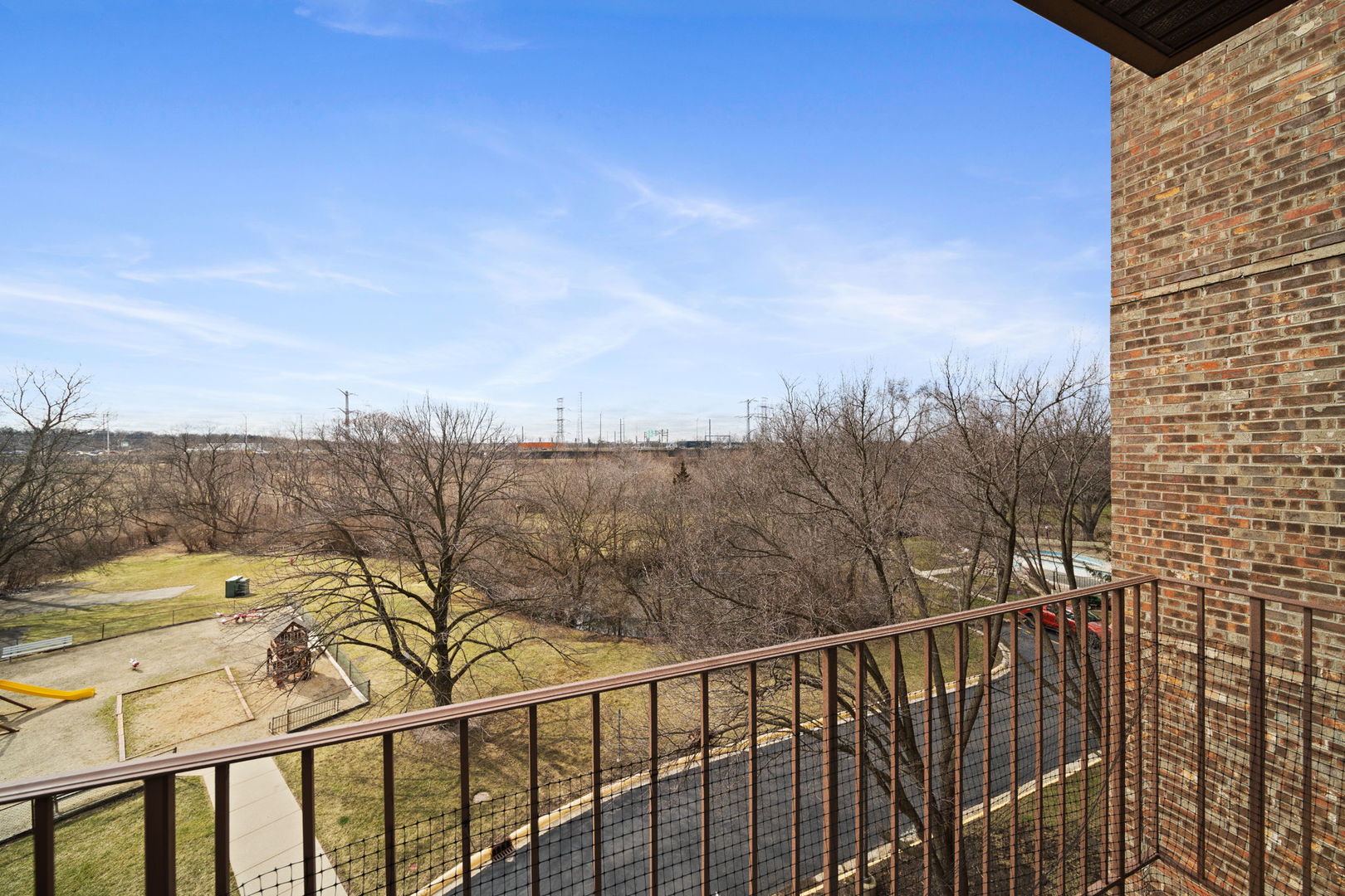 425 Walnut Creek Road, Unit 1401 Lisle, IL 60532 - Photo 5 of 19 a view of a balcony with an outdoor space