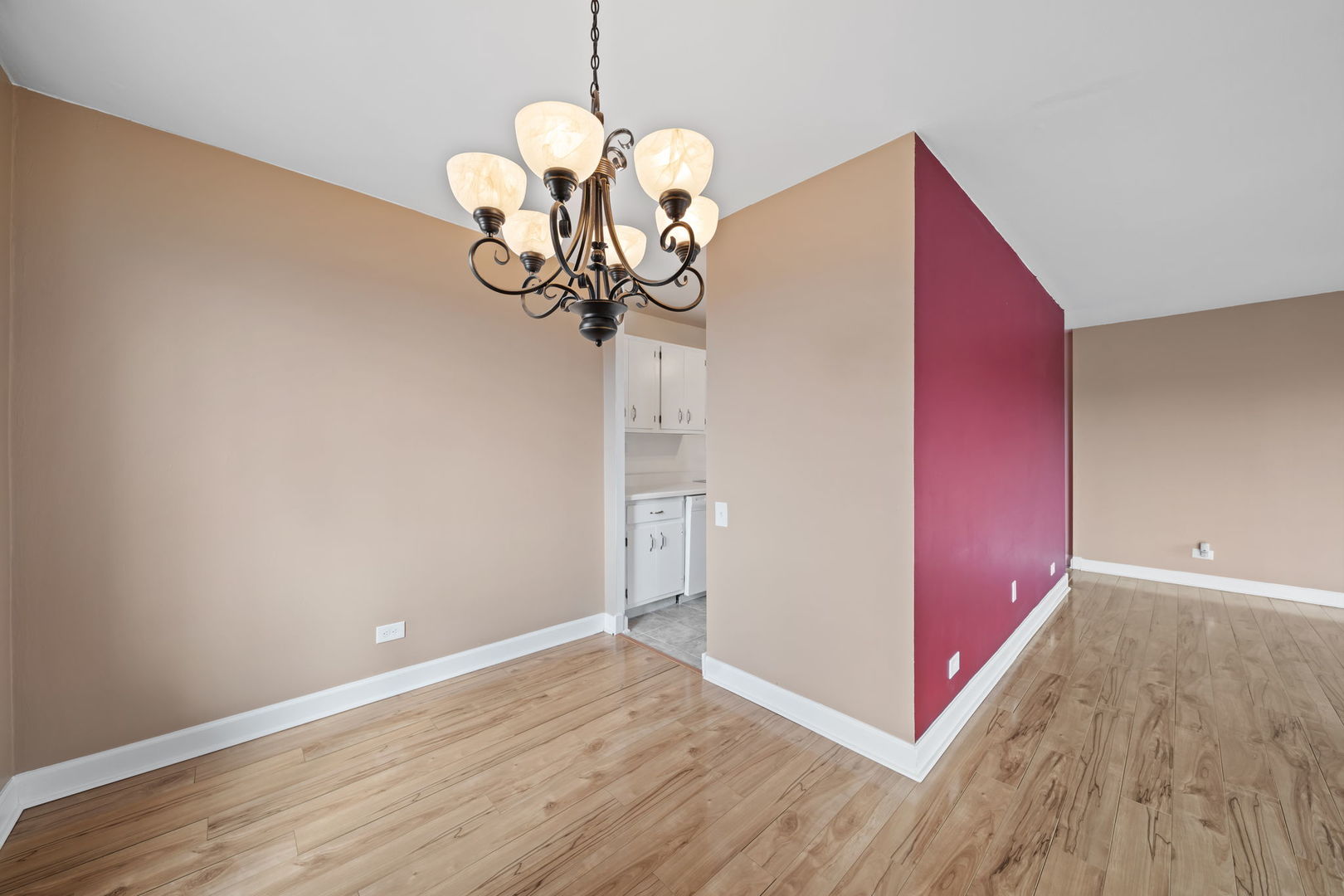 425 Walnut Creek Road, Unit 1401 Lisle, IL 60532 - Photo 6 of 19 a view of a livingroom with a chandelier