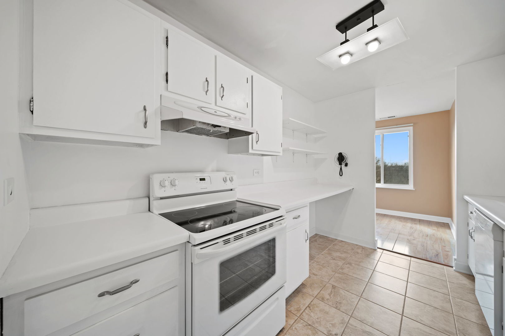 425 Walnut Creek Road, Unit 1401 Lisle, IL 60532 - Photo 8 of 19 a kitchen with white cabinets and appliances