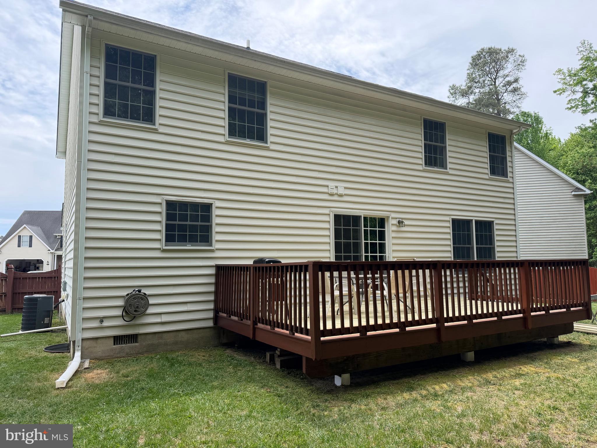 112 Rilian Court Grasonville, MD 21638 - Photo 4 of 55 a view of a house with a backyard and deck