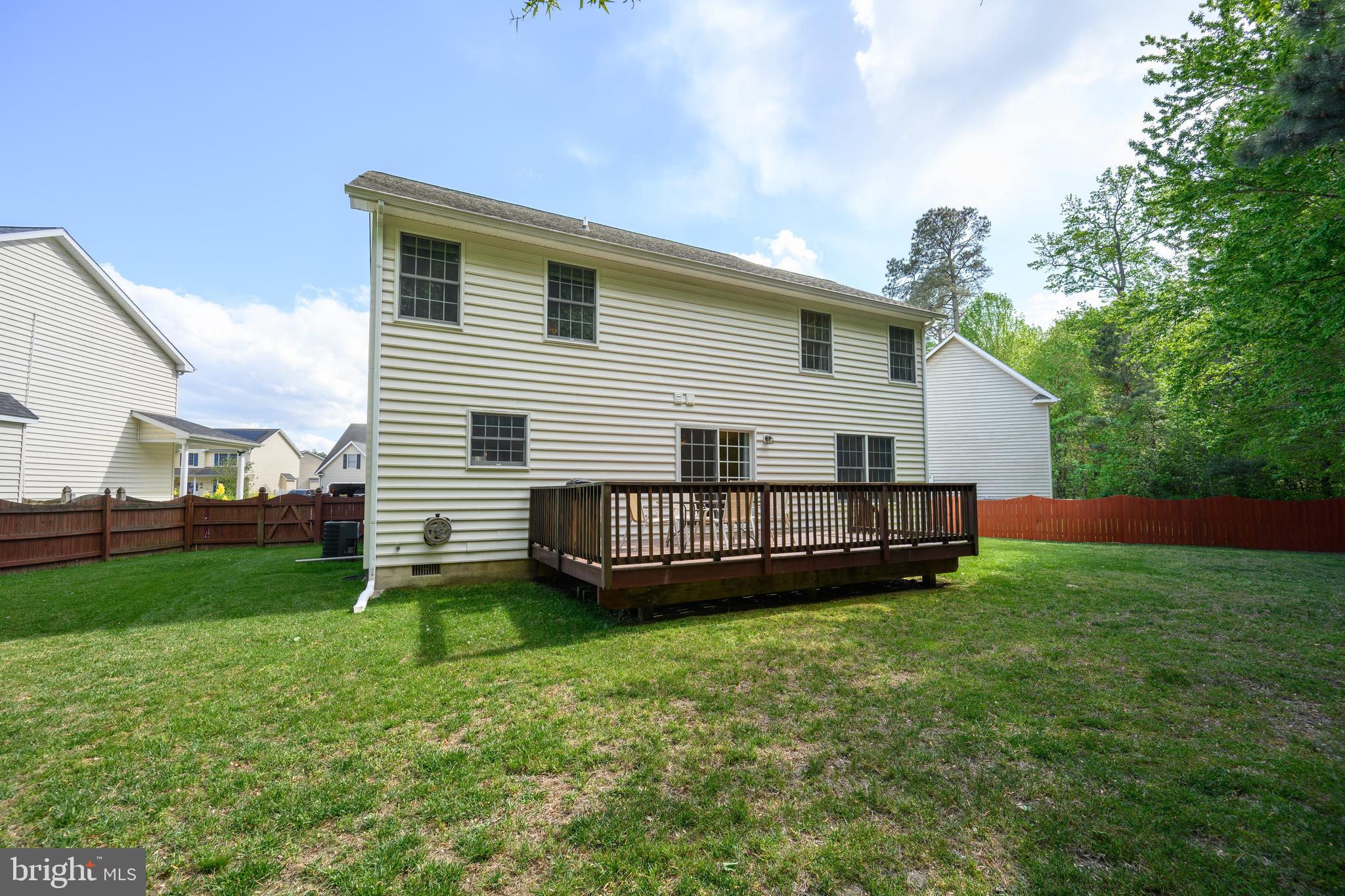 112 Rilian Court Grasonville, MD 21638 - Photo 44 of 55 a view of a house with a yard and deck