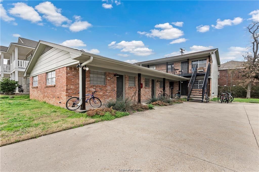 3906 Aspen Street, Unit B Bryan, TX 77801 - Photo 1 of 1 View of side of property with a lawn
