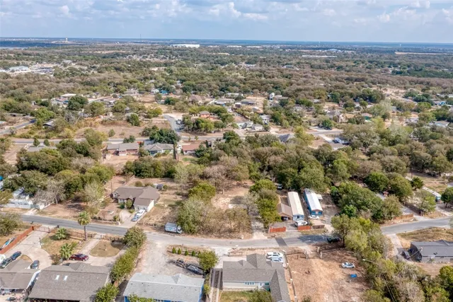 an aerial view of residential building and parking space