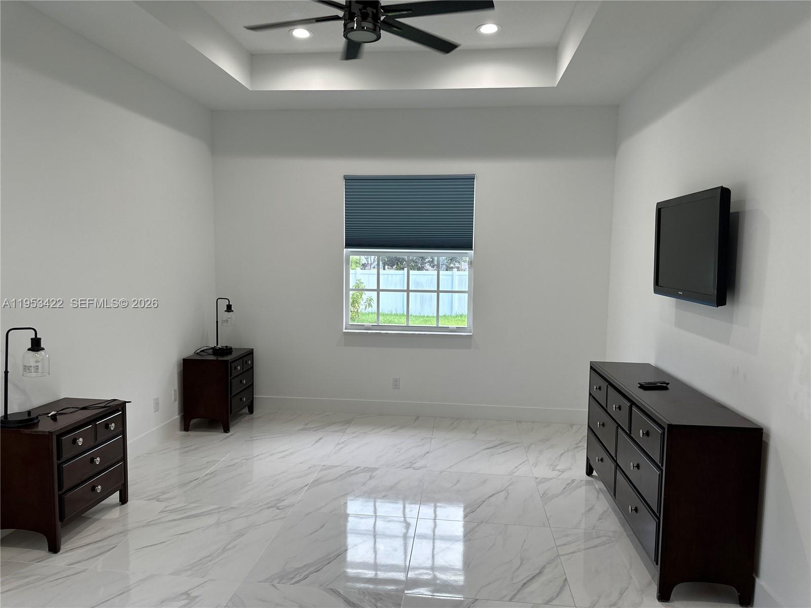 1222 Southwest Herald Road Port St. Lucie, FL 34953 - Photo 11 of 25 a living room with furniture and a flat screen tv