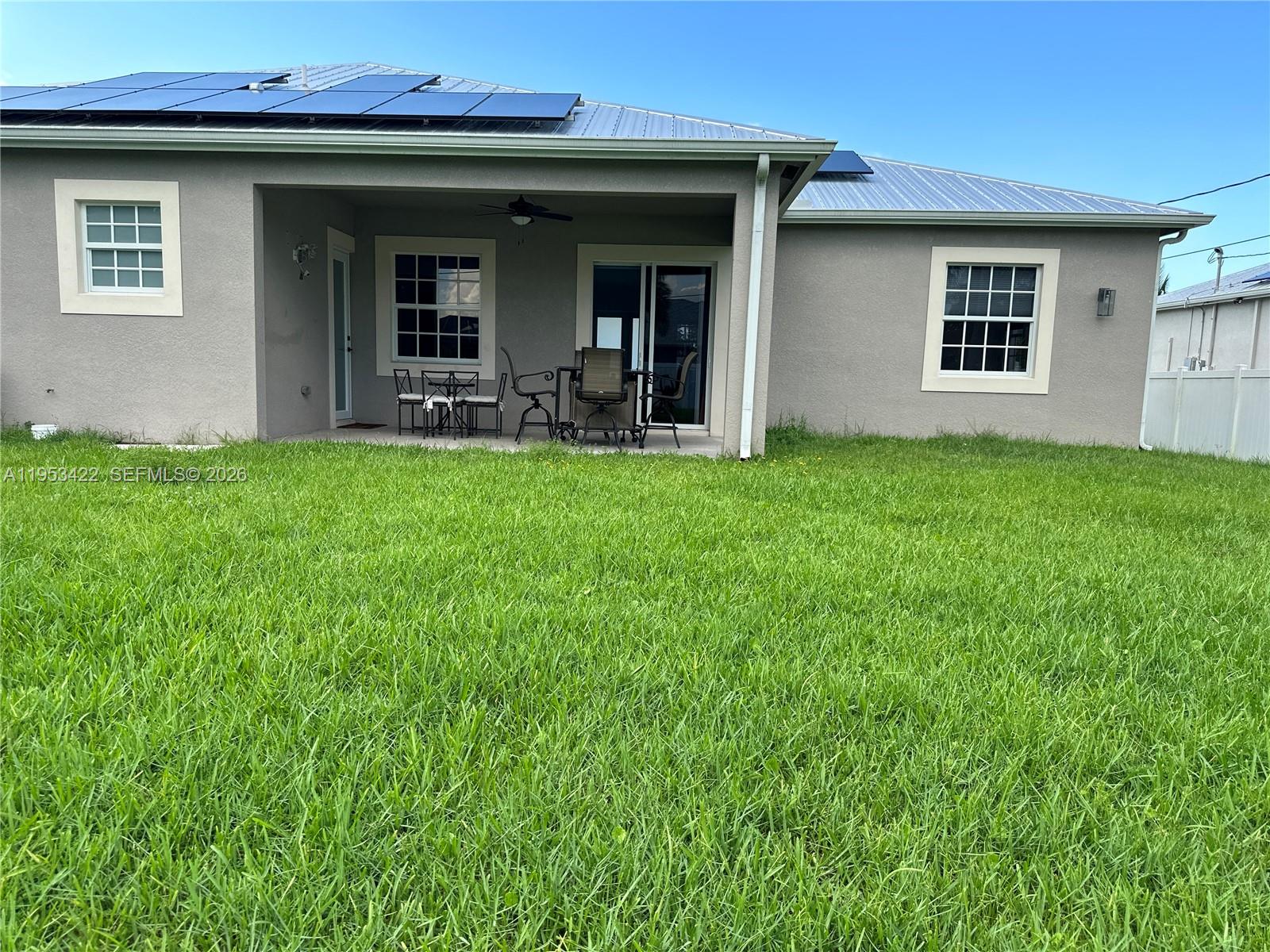 1222 Southwest Herald Road Port St. Lucie, FL 34953 - Photo 12 of 25 a view of a house with a backyard