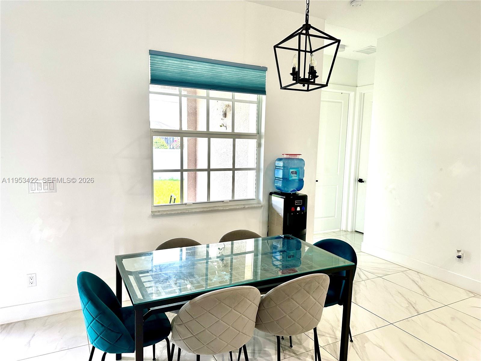 1222 Southwest Herald Road Port St. Lucie, FL 34953 - Photo 20 of 25 a view of a dining room with furniture window and outside view