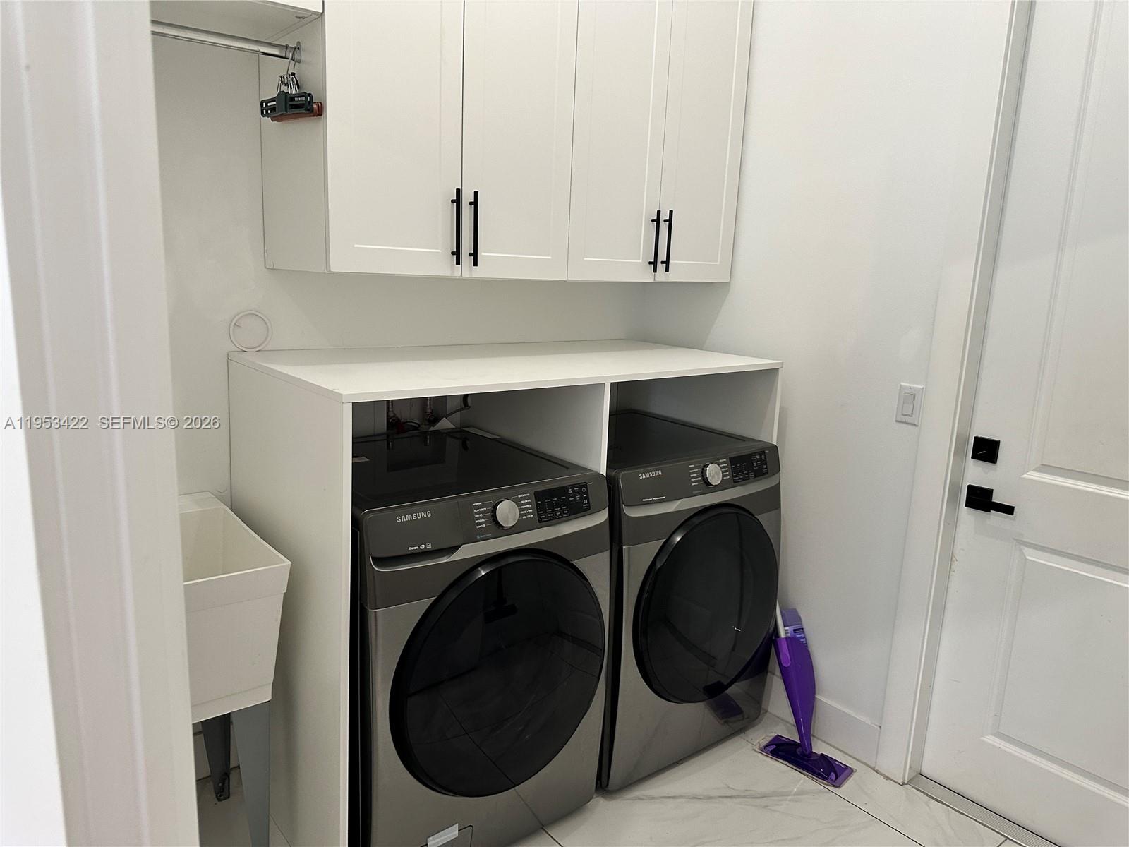 1222 Southwest Herald Road Port St. Lucie, FL 34953 - Photo 22 of 25 a view of a washer and dryer