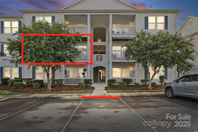 a front view of a house with a yard and a garage