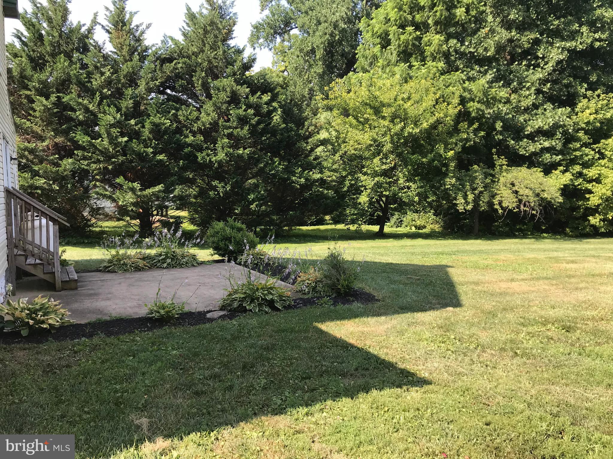 11914 Legore Bridge Road Keymar, MD 21757 - Photo 27 of 30 a view of a garden with large trees