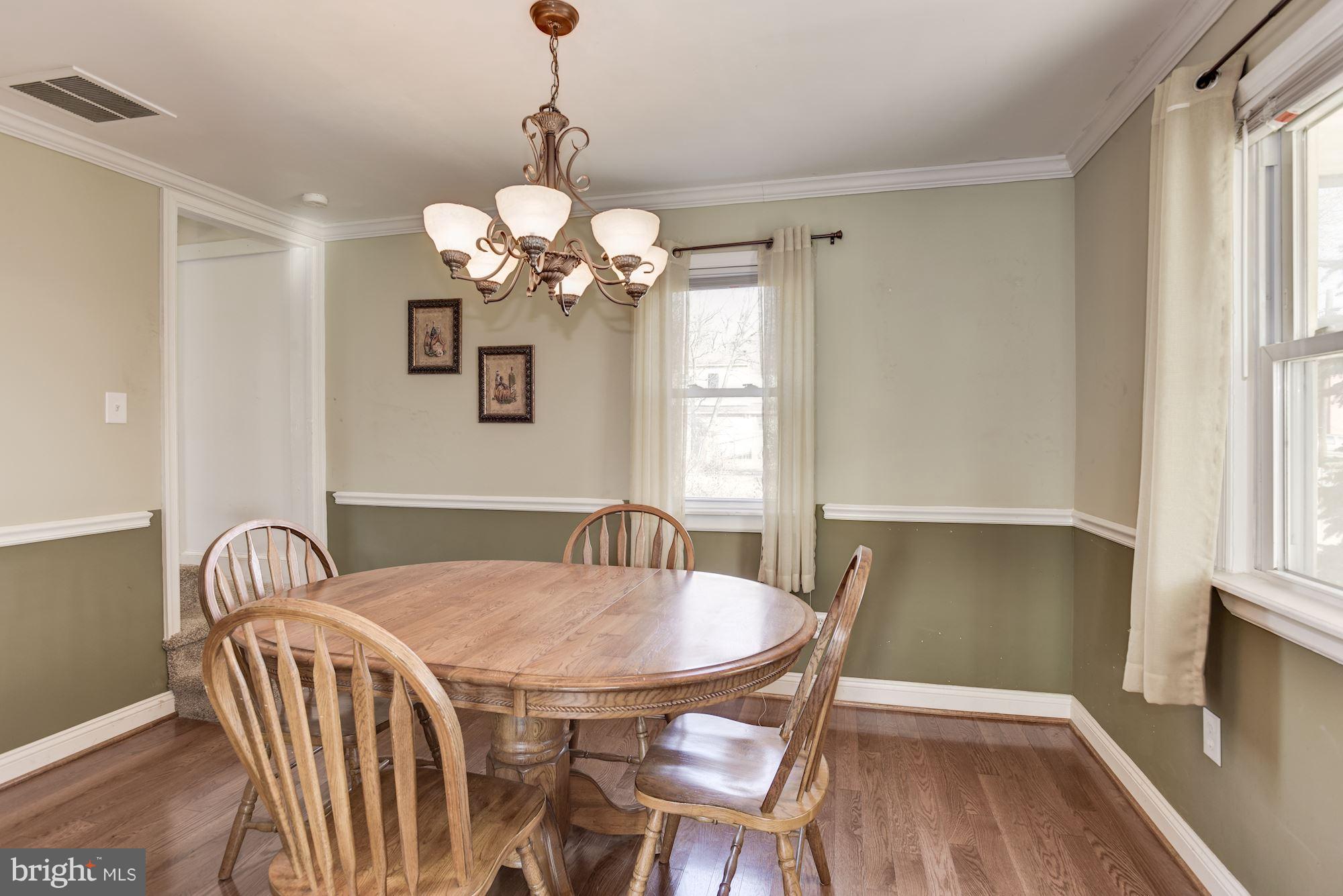 11914 Legore Bridge Road Keymar, MD 21757 - Photo 8 of 30 a view of a dining room with furniture wooden floor and chandelier