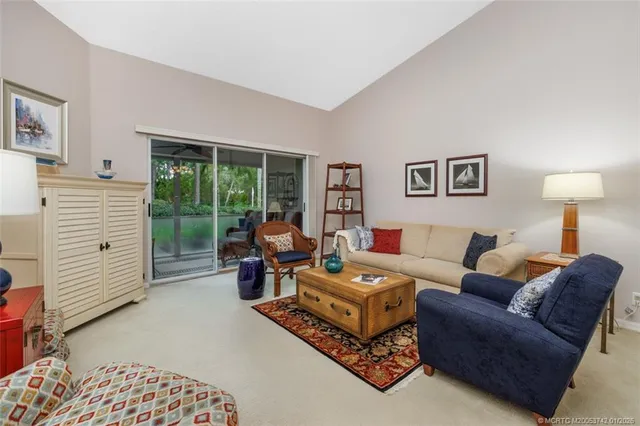 a kitchen with a refrigerator a sink and cabinets