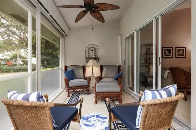 a bedroom with a bed couch and window