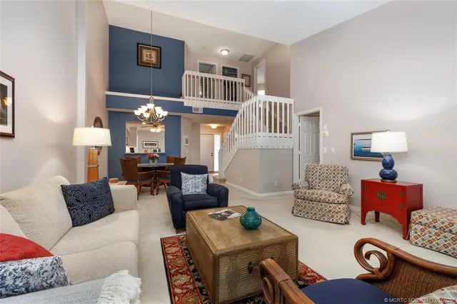 a spacious bedroom with a bed and a lamp