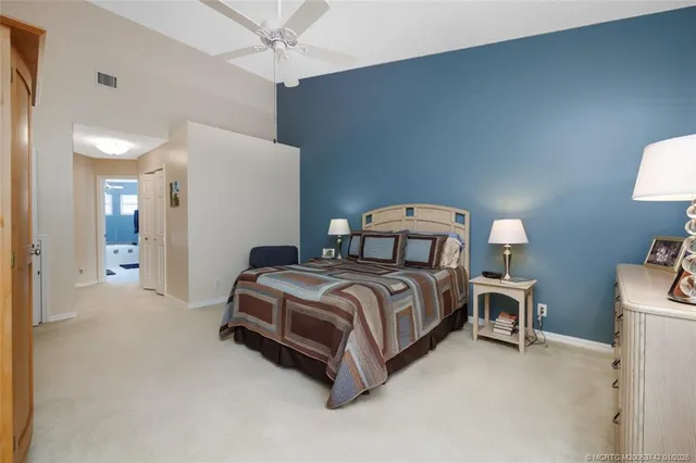 an aerial view of a house with garden space and outdoor seating
