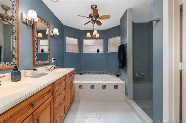 an aerial view of a residential houses with outdoor space and lake view