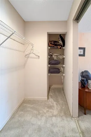 a dining room with furniture and a large window