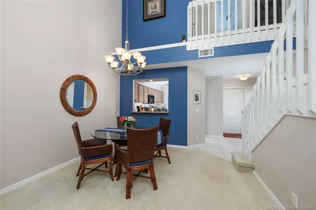 a kitchen with stainless steel appliances granite countertop a refrigerator sink and stove