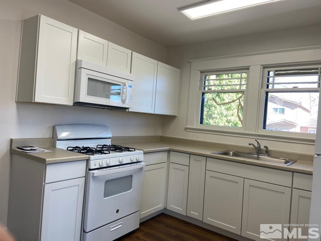 609 West 11th Street Reno, NV 89503 - Photo 15 of 29 a kitchen with cabinets appliances a sink and a window