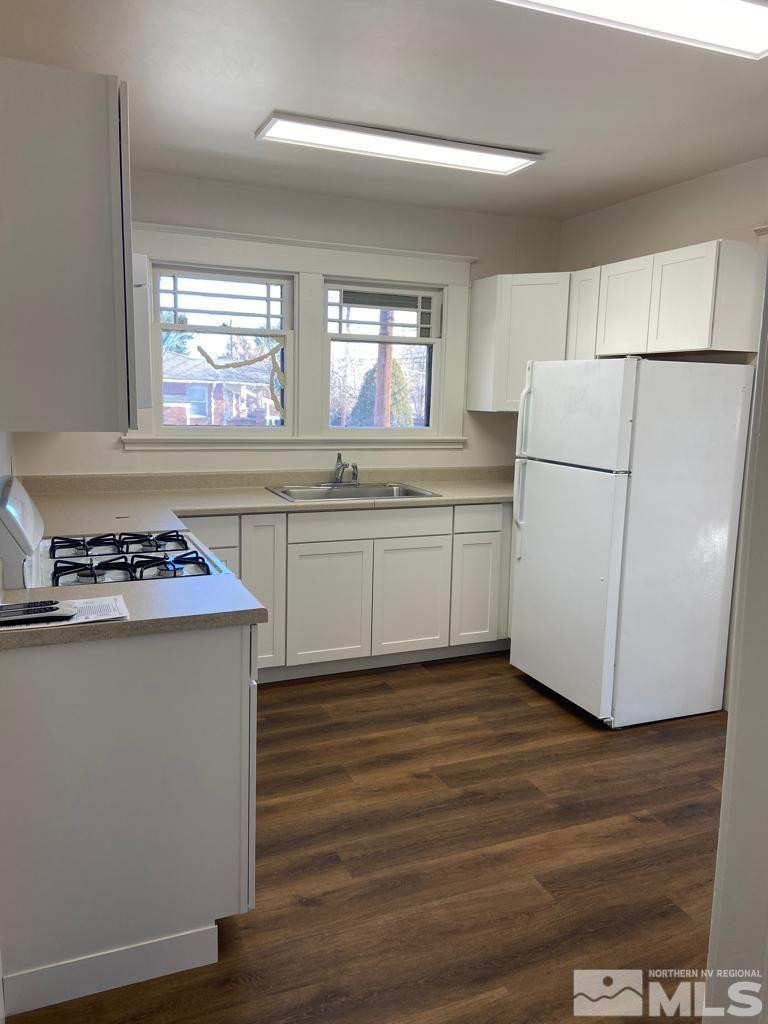 609 West 11th Street Reno, NV 89503 - Photo 16 of 29 a kitchen with stainless steel appliances granite countertop a stove a refrigerator and a more cabinets