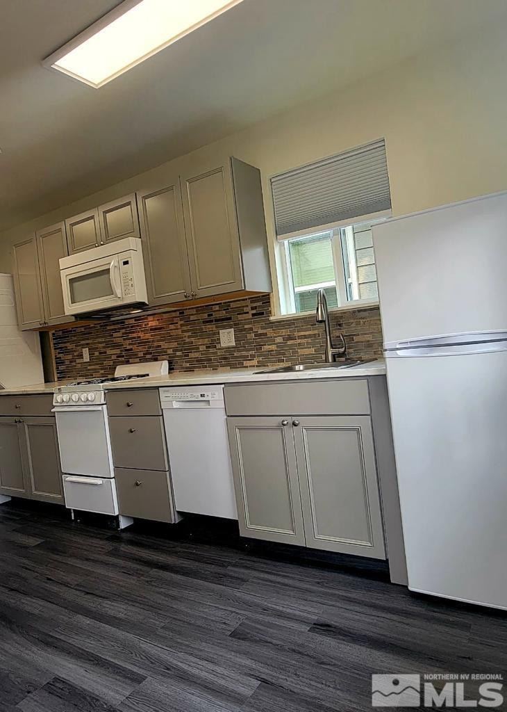 609 West 11th Street Reno, NV 89503 - Photo 28 of 29 a kitchen with a sink and a refrigerator