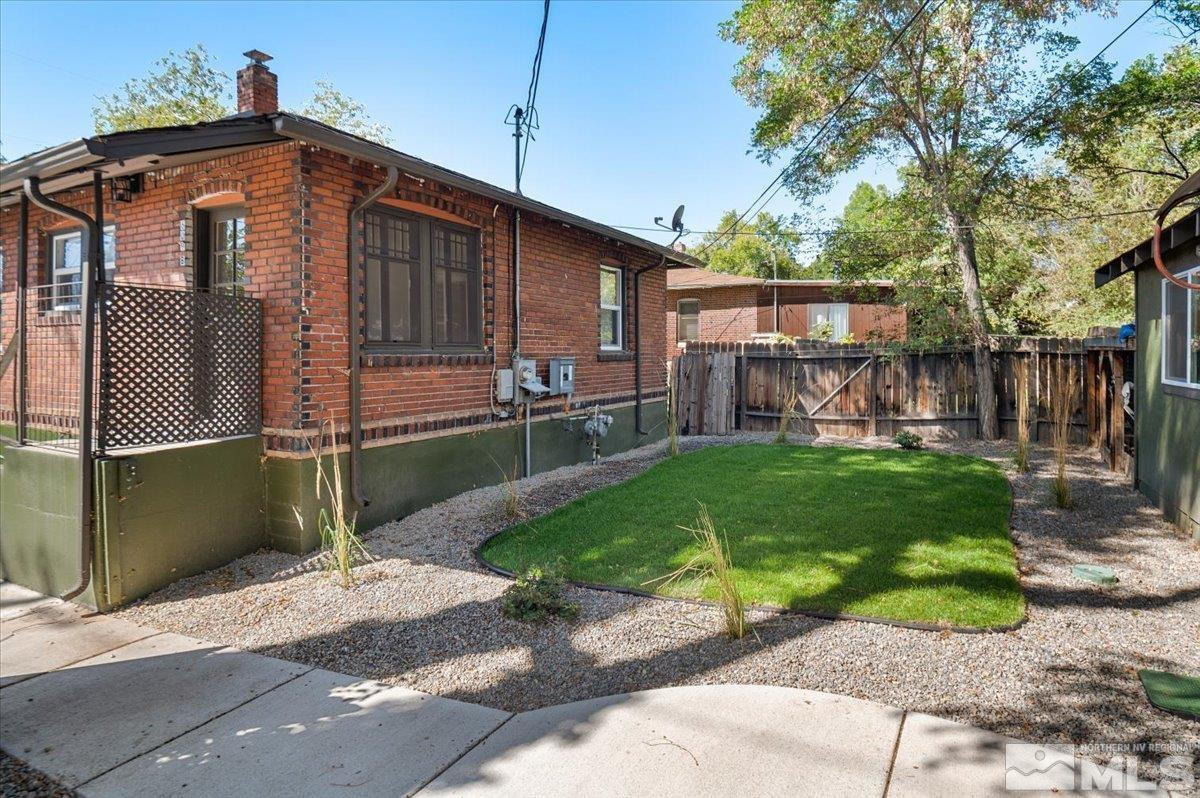 609 West 11th Street Reno, NV 89503 - Photo 9 of 29 a front view of a house with a yard and trees