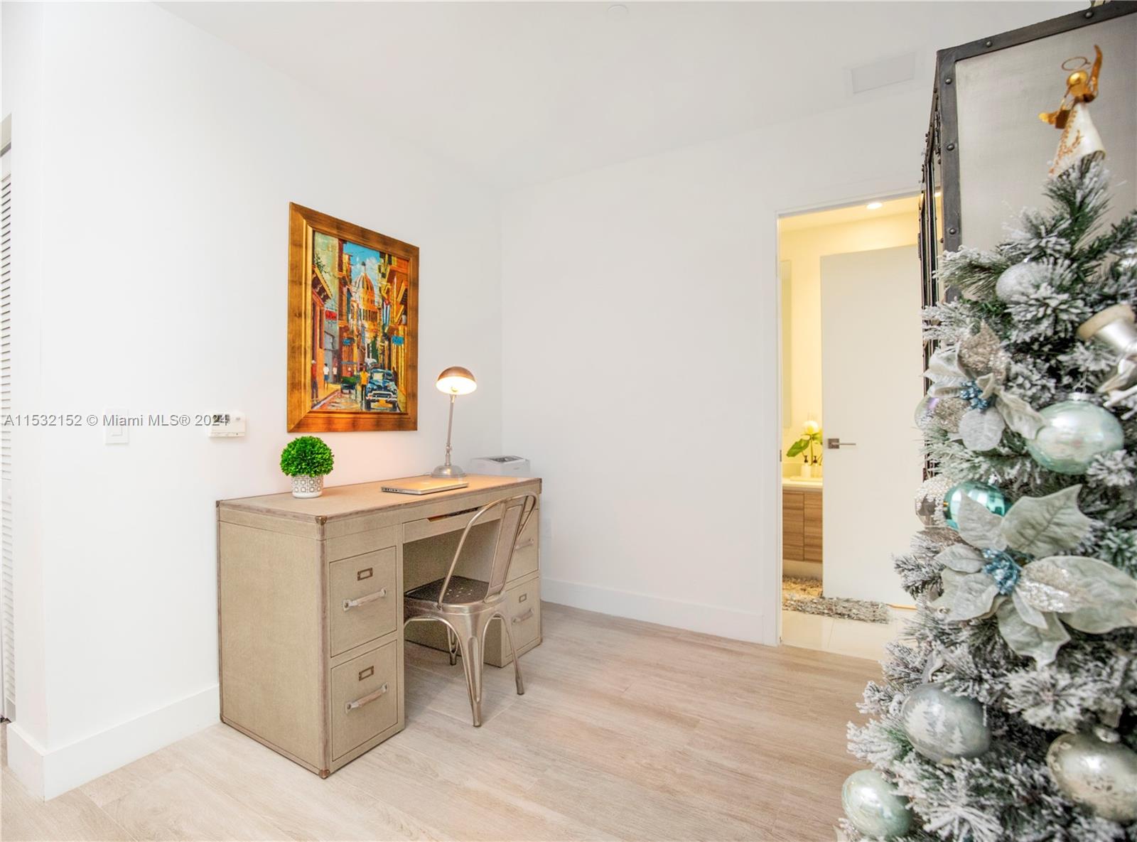 121 Northeast 34th Street, Unit L206 Miami, FL 33137 - Photo 6 of 18 a workspace with furniture and window