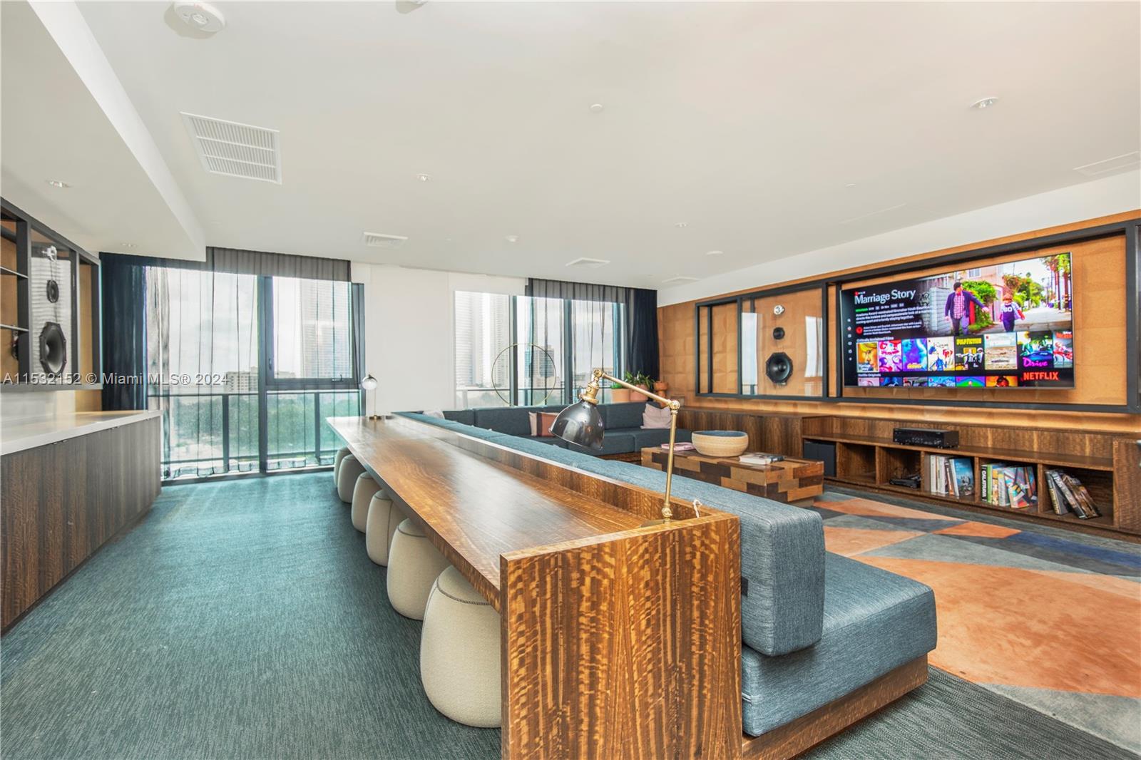 121 Northeast 34th Street, Unit L206 Miami, FL 33137 - Photo 10 of 18 a living room with furniture and a flat screen tv