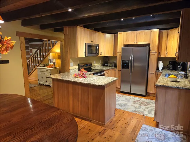 a kitchen with sink cabinets and window