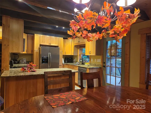 a bathroom with a granite countertop shower sink and vanity