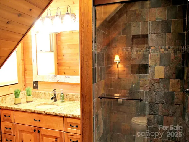 a bedroom with a bed and a mirror