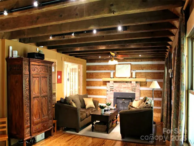 a bathroom with a bathtub and next to a window