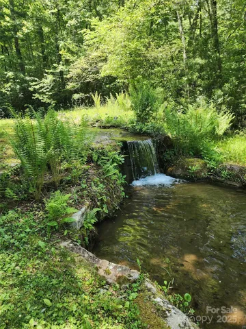 a view of a kitchen with furniture and a window