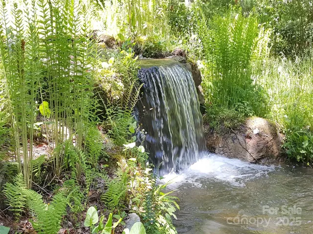 a kitchen with refrigerator cabinets and wooden floor