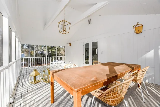 a bedroom with two beds and a painting on the wall