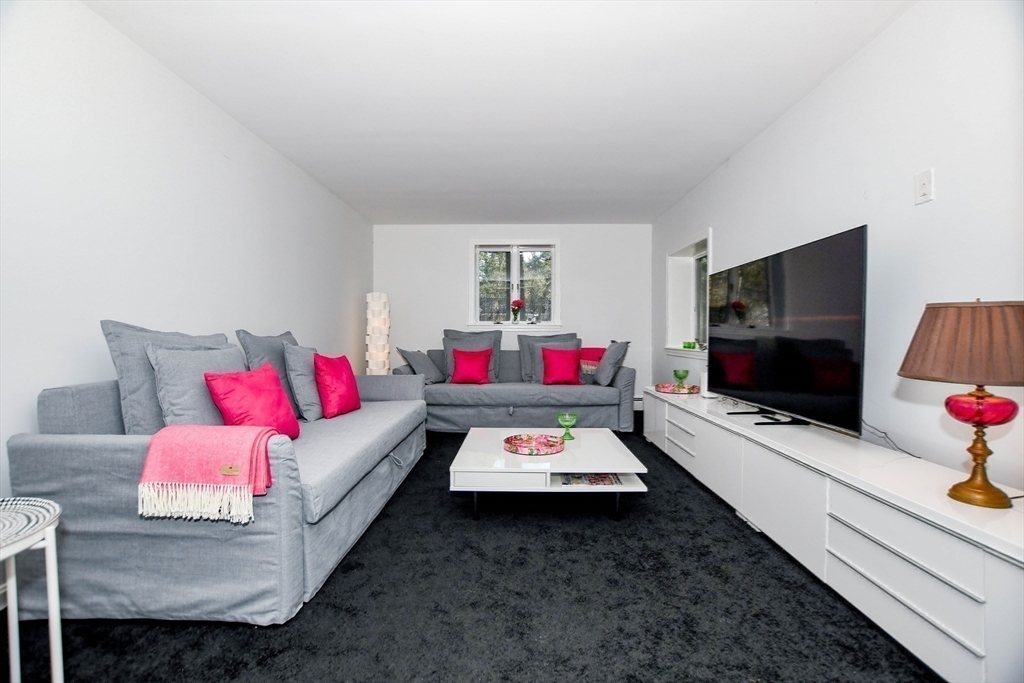 44 Register Road Marion, MA 02738 - Photo 23 of 38 a living room with furniture and a flat screen tv