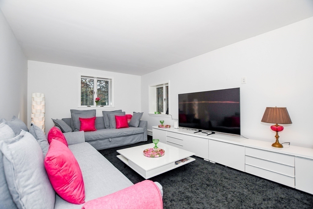 44 Register Road Marion, MA 02738 - Photo 24 of 38 a living room with furniture and a flat screen tv