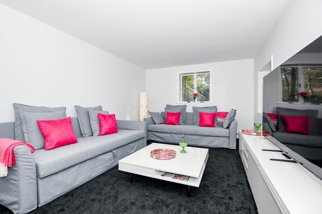 44 Register Road Marion, MA 02738 - Photo 25 of 38 a living room with furniture and a flat screen tv
