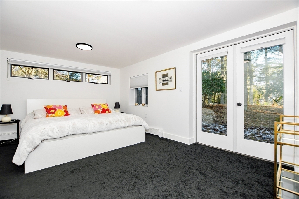 44 Register Road Marion, MA 02738 - Photo 27 of 38 a white bed sitting in a bedroom next to a window