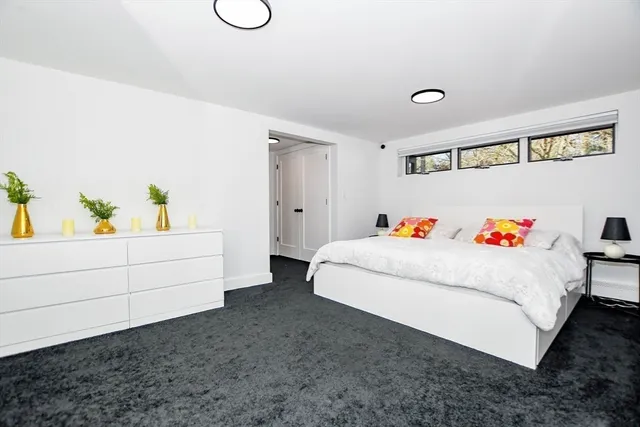a white bath tub sitting next to a toilet