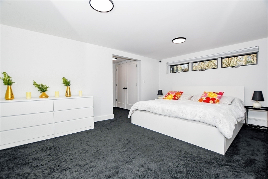 44 Register Road Marion, MA 02738 - Photo 28 of 38 a white bed sitting in a bedroom and couch