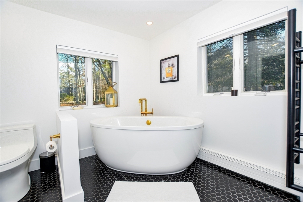 44 Register Road Marion, MA 02738 - Photo 29 of 38 a white bath tub sitting next to a toilet