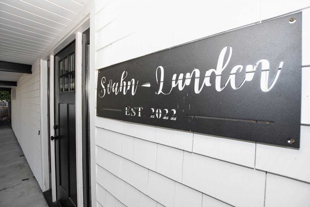 44 Register Road Marion, MA 02738 - Photo 3 of 38 a close up of a street sign