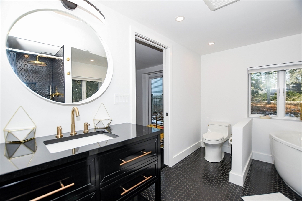 44 Register Road Marion, MA 02738 - Photo 31 of 38 a bathroom with a toilet a sink and a mirror