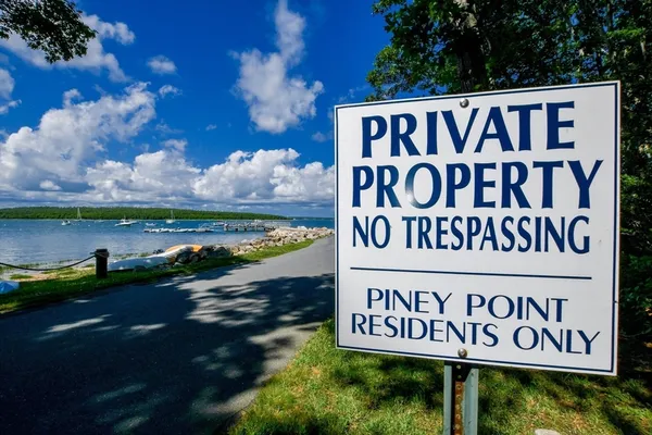 a view of a house with swimming pool and sitting area