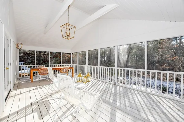 a bedroom with furniture and window