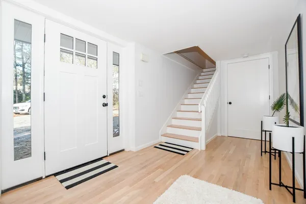 a living room with furniture and a rug