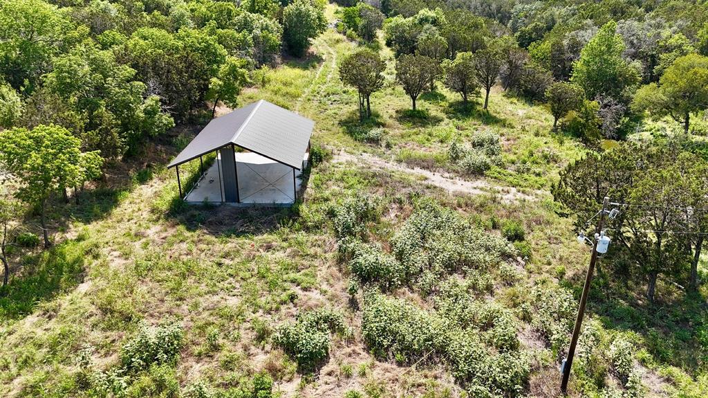 3000 Nech Ranch Court Granbury, TX 76048 - Photo 18 of 26 a backyard of a house with a yard and outdoor seating