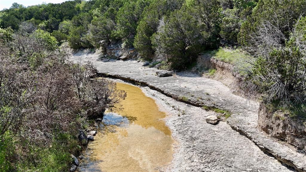 3000 Nech Ranch Court Granbury, TX 76048 - Photo 21 of 26 a view of a swimming pool with a yard